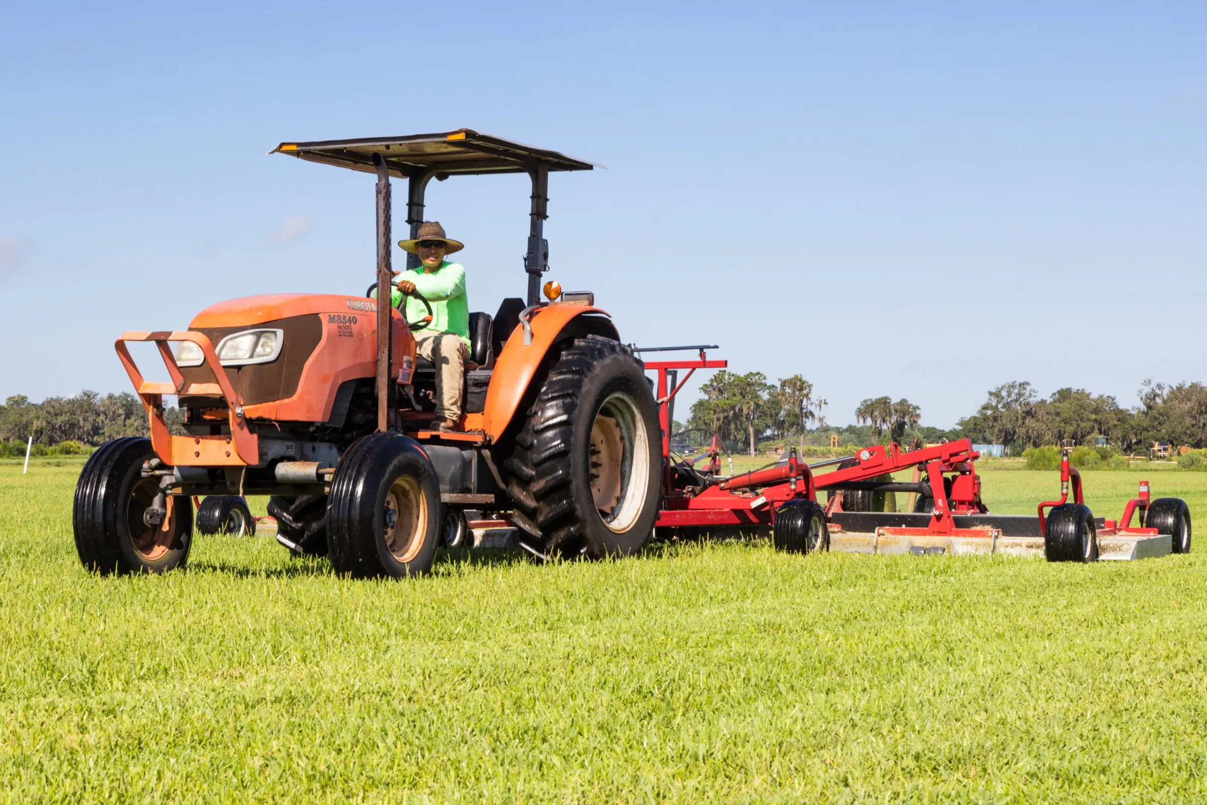 Tractor mowing a sod field at the Bayside Sod farm